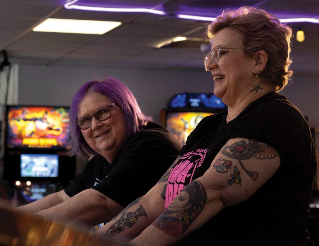 Delaware Pinball Collective Two Women Playing Pinball